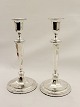 A pair of English silver candlesticks sold