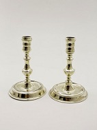 A pair of nstved brass candlesticks