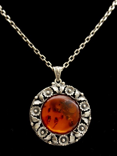 N E From sterling silver necklace and pendant  with amber sold