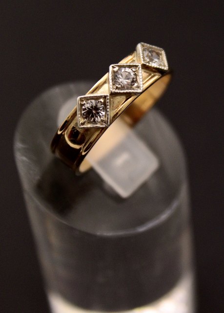14 carat gold ring  with three zircons