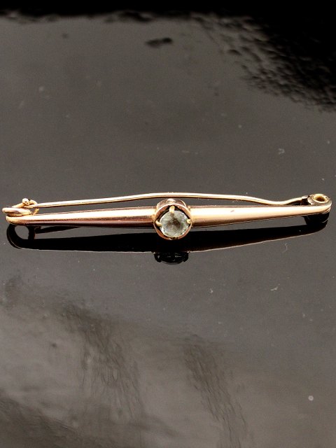 8 carat gold tie needle with blue stone