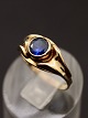 8 carat gold ring  with sapphire colored stone