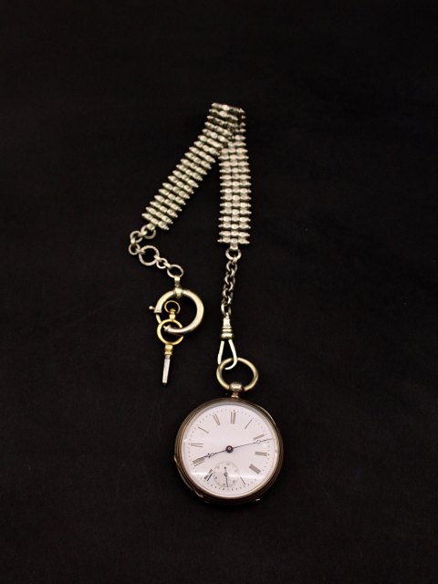 Pocket watch with key pulls and clock chain